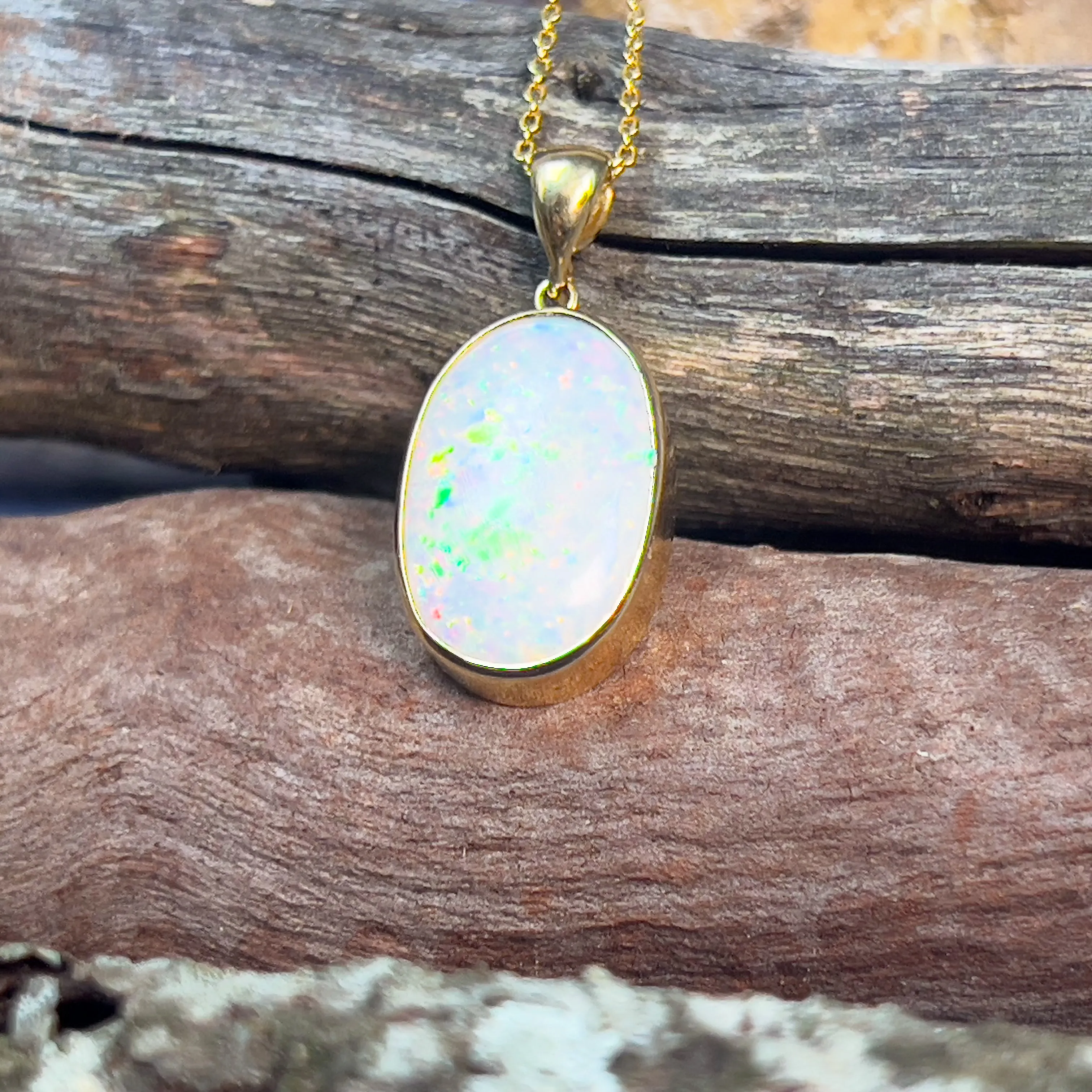 18kt Yellow Gold classic Oval White Opal 6.98ct bezel set pendant