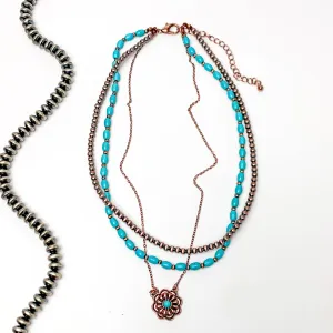 3 Strand Faux Turquoise beads and Copper Tone Navajo Pearls with a Dangling Flower Pendent in Copper Tone